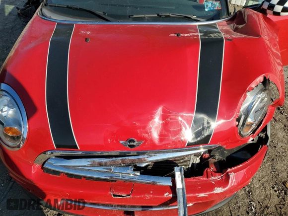 2013 MINI Convertible with VIN WMWZN3C58DT265980, listed as a Copart auction lot 77157154 with 88,975 mi miles and Salvage title. Bid and sale history available at DreamBid. Image 11.