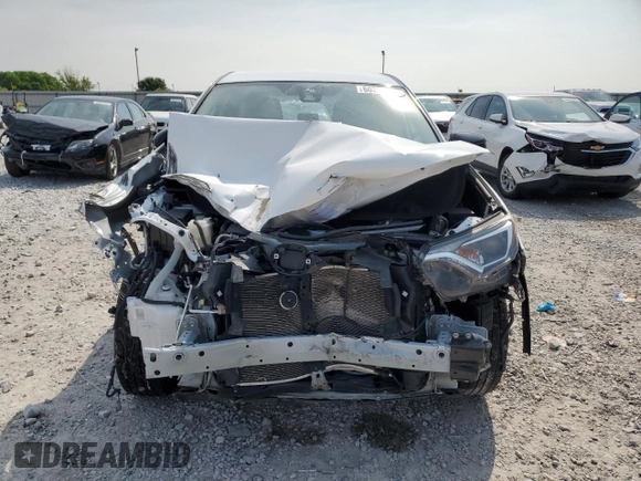 2018 Toyota RAV4 LE with VIN 2T3BFREV2JW780824, listed as a Copart auction lot 60258635 with 59,030 mi miles and Salvage title. Bid and sale history available at DreamBid. Image 5.