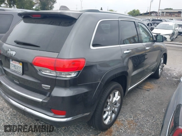 2014 Jeep Grand Cherokee Summit with VIN 1C4RJFJG8EC434899, listed as a IAAI auction lot 42399912 with 186,840 mi miles and . Bid and sale history available at DreamBid. Image 4.