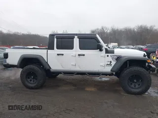 2020 Jeep Gladiator Sport S z VIN 1C6HJTAG0LL129461, wystawiony jako IAAI lot #41464713 z przebiegiem 66 625 mil mil oraz . Historia ofert i sprzedaży dostępna na DreamBid. Obrazek 13.