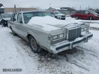 1986 Lincoln Town Car with VIN 1LNBP96F6GY618970, listed as a IAAI auction lot 41609991 with 22,768 mi miles. Bid and sale history available at carsss.com. Image 1.