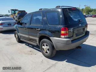 2001 Ford Escape XLT with VIN 1FMYU031X1KF31462, listed as a IAAI auction lot 41784891 with 372,527 mi miles. Bid and sale history available at carsss.com. Image 3.