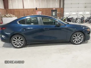 2021 Mazda 3 Select with VIN 3MZBPBBL3MM251893, listed as a IAAI auction lot 41854476 with 56,661 mi miles and . Bid and sale history available at DreamBid. Image 13.