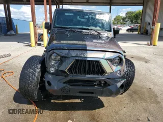 2018 Jeep Wrangler JK Unlimited Sport S with VIN 1C4BJWDG7JL814226, listed as a Copart auction lot 72442484 with 49,658 mi miles and Salvage Title. Bid and sale history available at carsss.com. Image 5.