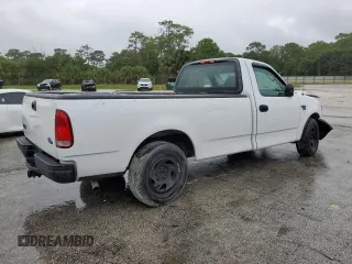 2002 Ford F-150 XL with VIN 1FTRF17W32NB86385, listed as a Copart auction lot 73276754 with 100,817 mi miles and Salvage Title. Bid and sale history available at carsss.com. Image 3.
