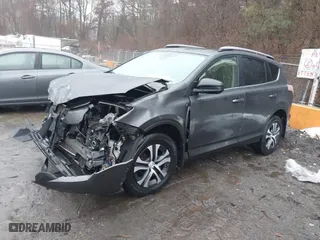 2018 Toyota RAV4 LE with VIN JTMBFREV6JJ242450, listed as a IAAI auction lot 41478603 with 90,997 mi miles. Bid and sale history available at carsss.com. Image 18.