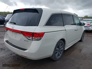 2015 Honda Odyssey Touring Elite with VIN 5FNRL5H98FB076428, listed as a IAAI auction lot 41998339 with 114,573 mi miles. Bid and sale history available at carsss.com. Image 4.