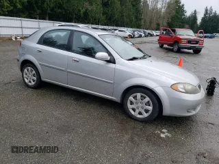 2005 Suzuki Reno S z VIN KL5JD66Z95K217050, wystawiony jako Copart lot #86785194 z przebiegiem 77 614 mil mil oraz Szkody całkowita. Historia ofert i sprzedaży dostępna na DreamBid. Obrazek 4.