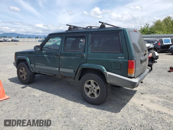 1999 Jeep Cherokee Sport with VIN 1J4FF68S2XL570795, listed as a Copart auction lot 61860585 with 320,467 mi miles and Salvage title. Bid and sale history available at DreamBid. Image 2.