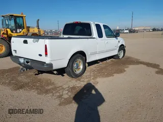 1998 Ford F-150 with VIN 1FTZX17W3WKB43668, listed as a IAAI auction lot 41243322 with 154,780 mi miles and . Bid and sale history available at DreamBid. Image 4.