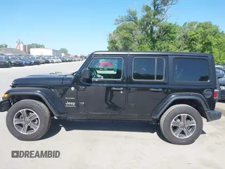 2023 Jeep Wrangler Sahara with VIN 1C4HJXEN5PW702268, listed as a IAAI auction lot 42288704 with 57,240 mi miles and . Bid and sale history available at DreamBid. Image 14.