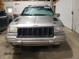 1998 Jeep Grand Cherokee Limited with VIN 1J4GZ88Z1WC289820, listed as a Copart auction lot 88583995 with 245,572 mi miles and Clean Title. Bid and sale history available at carsss.com. Image 5.