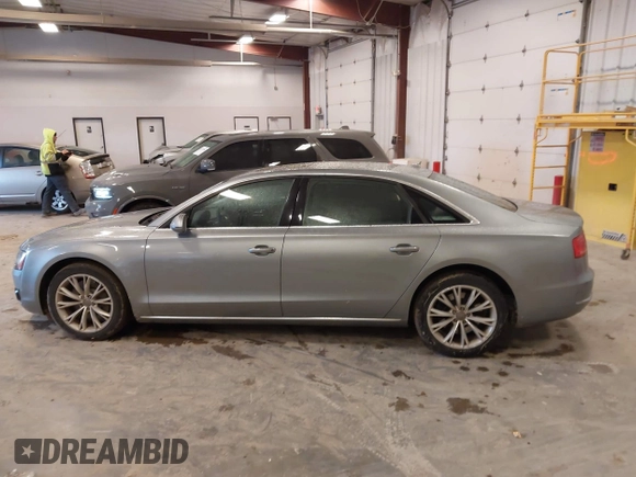 2012 Audi A8 with VIN WAURVAFD7CN021716, listed as a IAAI auction lot 42330229 with 97,359 mi miles and . Bid and sale history available at DreamBid. Image 14.