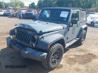 2015 Jeep Wrangler Freedom Edition with VIN 1C4AJWAG1FL714002, listed as a IAAI auction lot 42579024 with 98,732 mi miles and . Bid and sale history available at DreamBid. Image 6.