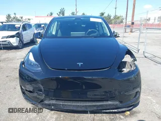 2025 Tesla Model Y Long Range with VIN 7SAYGDEE9SF278607, listed as a IAAI auction lot 41932084 with 9,667 mi miles and . Bid and sale history available at carsss.com. Image 13.