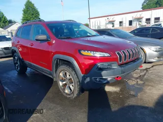 2014 Jeep Cherokee Trailhawk with VIN 1C4PJMBS2EW216499, listed as a IAAI auction lot 42482446 with 179,540 mi miles and . Bid and sale history available at DreamBid. Image 1.