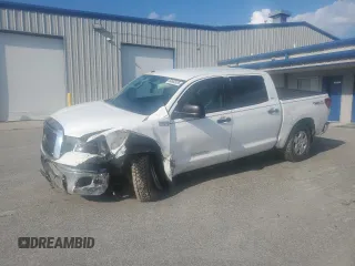 2013 Toyota Tundra with VIN 5TFDW5F14DX312543, listed as a Copart auction lot 60665635 with 61,278 mi miles and Salvage title. Bid and sale history available at DreamBid. Image 1.