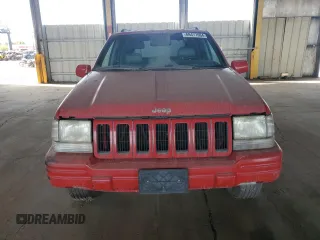 1998 Jeep Grand Cherokee Limited with VIN 1J4GZ78Y0WC294461, listed as a Copart auction lot 69477664 with 209,295 mi miles and Clean Title. Bid and sale history available at carsss.com. Image 5.