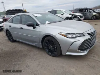 2022 Toyota Avalon Hybrid XSE Nightshade with VIN 4T1EA1AB2NU013126, listed as a IAAI auction lot 40991091 with NaN miles. Bid and sale history available at carsss.com. Image 1.