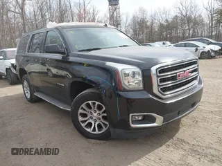 2015 GMC Yukon SLT z VIN 1GKS1BKCXFR192349, wystawiony jako IAAI lot #41842474 z przebiegiem 185 166 mil mil oraz . Historia ofert i sprzedaży dostępna na DreamBid. Obrazek 1.