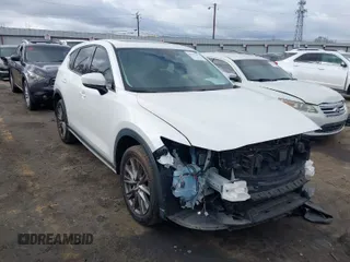 2021 Mazda CX-5 Grand Touring with VIN JM3KFADM2M1338999, listed as a IAAI auction lot 41707911 with 86,184 mi miles. Bid and sale history available at carsss.com. Image 1.