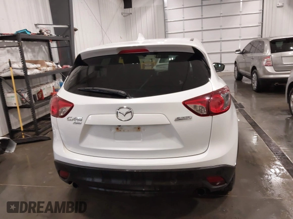 2015 Mazda CX-5 Grand Touring with VIN JM3KE4DY4F0495627, listed as a IAAI auction lot 41887773 with 130,421 mi miles. Bid and sale history available at carsss.com. Image 17.