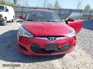 2014 Hyundai Veloster with VIN KMHTC6AD2EU214847, listed as a IAAI auction lot 42067728 with 77,421 mi miles. Bid and sale history available at carsss.com. Image 6.
