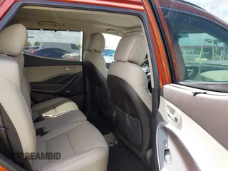 2014 Hyundai Santa Fe z VIN 5XYZUDLB4EG138898, wystawiony jako IAAI lot #42196491 z przebiegiem Nie podano mil oraz . Historia ofert i sprzedaży dostępna na DreamBid. Obrazek 8.