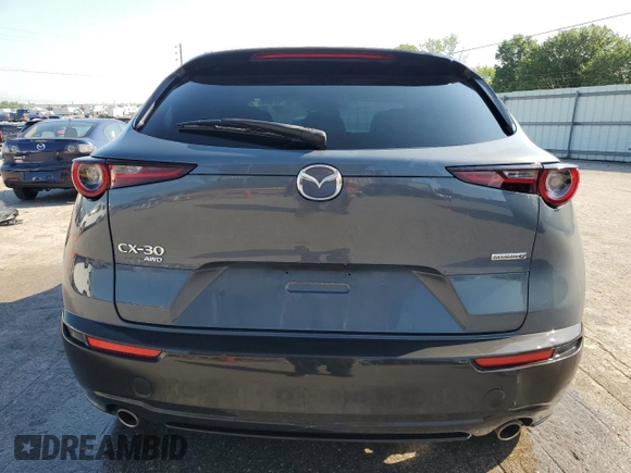 2023 Mazda CX-30 S Carbon Edition with VIN 3MVDMBCM1PM553374, listed as a Copart auction lot 62080975 with 51,527 mi miles and Salvage title. Bid and sale history available at DreamBid. Image 6.
