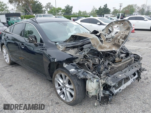 2014 Mazda 6 i Touring with VIN JM1GJ1T6XE1162480, listed as a IAAI auction lot 42150777 with 148,113 mi miles and . Bid and sale history available at DreamBid. Image 1.