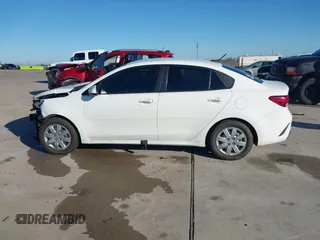 2023 Kia Rio S z VIN 3KPA24AD9PE567364, wystawiony jako IAAI lot #41145615 z przebiegiem 82 143 mil mil oraz . Historia ofert i sprzedaży dostępna na DreamBid. Obrazek 14.