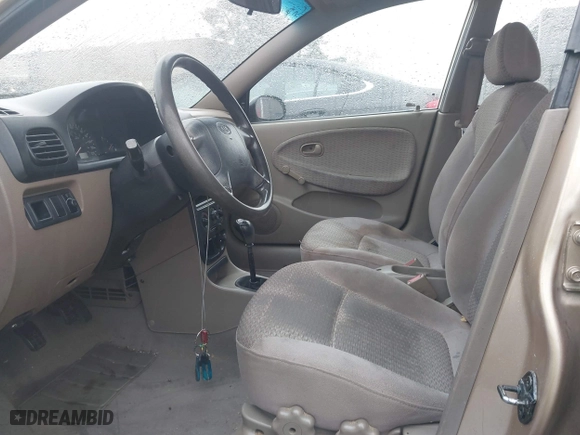 2002 Kia Rio with VIN KNADC123626192611, listed as a IAAI auction lot 41765104 with 62,387 mi miles. Bid and sale history available at carsss.com. Image 5.