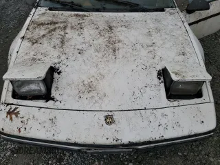 1984 Pontiac Fiero z VIN 1G2AF37R6EP320306, wystawiony jako Copart lot #68255394 z przebiegiem 49 284 mil mil oraz Tytuł czysty. Historia ofert i sprzedaży dostępna na DreamBid. Obrazek 11.