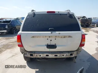 2003 Jeep Grand Cherokee Laredo with VIN 1J4GX48S43C518584, listed as a IAAI auction lot 42213094 with 163,743 mi miles and . Bid and sale history available at DreamBid. Image 17.