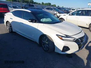 2023 Nissan Maxima Platinum z VIN 1N4AA6FV5PC507501, wystawiony jako IAAI lot #42180668 z przebiegiem 49 100 mil mil oraz . Historia ofert i sprzedaży dostępna na DreamBid. Obrazek 1.