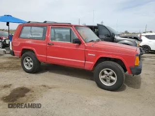1993 Jeep Cherokee SE with VIN 1J4FT27P2PL619945, listed as a Copart auction lot 59053465 with 222,336 mi miles and Clean title. Bid and sale history available at DreamBid. Image 4.