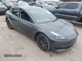 2022 Tesla Model 3 Performance with VIN 5YJ3E1EC9NF130410, listed as a IAAI auction lot 41711708 with 26,937 mi miles. Bid and sale history available at carsss.com. Image 1.