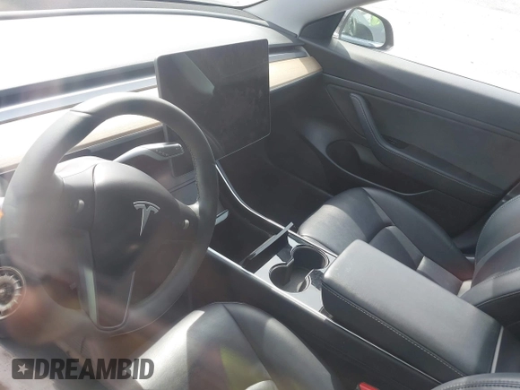 2020 Tesla Model 3 Standard Range Plus with VIN 5YJ3E1EAXLF643807, listed as a IAAI auction lot 41789406 with 49,256 mi miles. Bid and sale history available at carsss.com. Image 16.