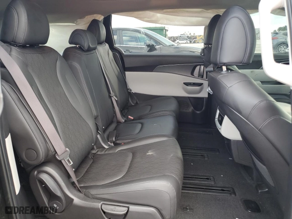 2023 Kia Carnival LX with VIN KNDNB4H38P6255833, listed as a Copart auction lot 86990124 with 6,818 mi miles and Salvage Title. Bid and sale history available at carsss.com. Image 12.