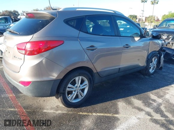 2013 Hyundai Tucson GLS with VIN KM8JU3AC0DU705782, listed as a IAAI auction lot 41804846 with 81,260 mi miles. Bid and sale history available at carsss.com. Image 4.