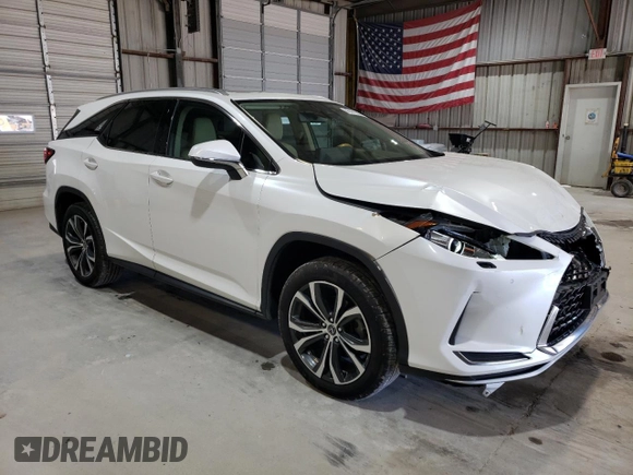 2020 Lexus RX 350L with VIN JTJHZKFA3L2025792, listed as a Copart auction lot 43141085 with 95,096 mi miles and Salvage title. Bid and sale history available at DreamBid. Image 4.