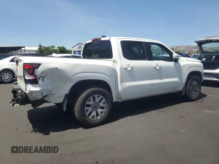 2022 Nissan Frontier Pro-4X with VIN 1N6ED1EKXNN674402, listed as a Copart auction lot 57417245 with 13,986 mi miles and Salvage title. Bid and sale history available at DreamBid. Image 3.