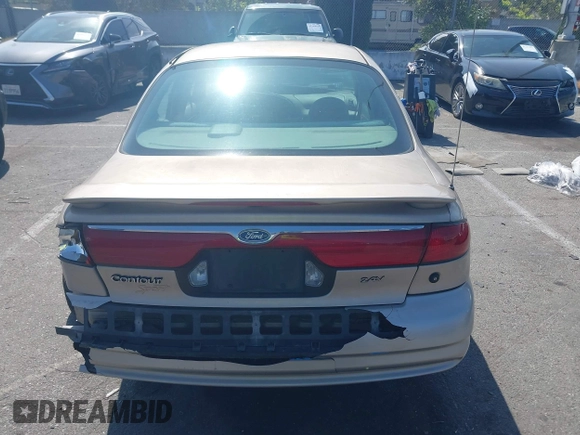 1999 Ford Contour z VIN 3FAFP66L6XM102099, wystawiony jako IAAI lot #42161889 z przebiegiem 100 340 mil mil oraz . Historia ofert i sprzedaży dostępna na DreamBid. Obrazek 16.