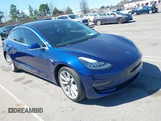 2018 Tesla Model 3 Long Range Battery z VIN 5YJ3E1EA3JF049959, wystawiony jako IAAI lot #41821507 z przebiegiem Nie podano mil oraz . Historia ofert i sprzedaży dostępna na DreamBid. Obrazek 1.