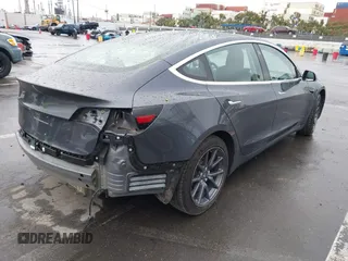 2018 Tesla Model 3 Long Range Battery with VIN 5YJ3E1EB7JF114305, listed as a IAAI auction lot 41765994 with 76,945 mi miles and . Bid and sale history available at DreamBid. Image 4.