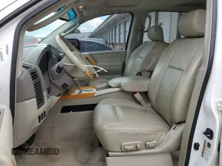 2006 Infiniti QX56 z VIN 5N3AA08C36N812620, wystawiony jako Copart lot #56465155 z przebiegiem 190 128 mil mil oraz Szkody całkowita. Historia ofert i sprzedaży dostępna na DreamBid. Obrazek 7.