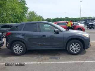 2016 Mazda CX-5 Touring z VIN JM3KE4CY4G0692655, wystawiony jako IAAI lot #42318657 z przebiegiem 212 826 mil mil oraz . Historia ofert i sprzedaży dostępna na DreamBid. Obrazek 13.