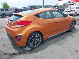 2016 Hyundai Veloster Turbo z VIN KMHTC6AE8GU302247, wystawiony jako IAAI lot #42619624 z przebiegiem 35 112 mil mil oraz . Historia ofert i sprzedaży dostępna na DreamBid. Obrazek 4.