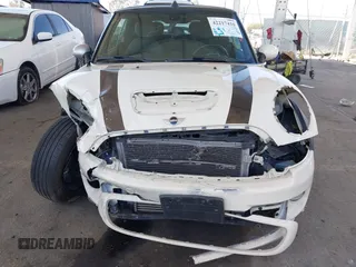 2014 MINI Convertible S with VIN WMWZP3C5XET706911, listed as a IAAI auction lot 42217410 with 54,649 mi miles and . Bid and sale history available at DreamBid. Image 12.