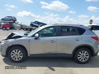 2014 Mazda CX-5 Touring z VIN JM3KE2CYXE0322943, wystawiony jako IAAI lot #41934670 z przebiegiem 110 690 mil mil oraz . Historia ofert i sprzedaży dostępna na DreamBid. Obrazek 14.